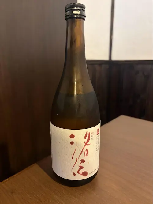 A bottle of Rakuden Junmai