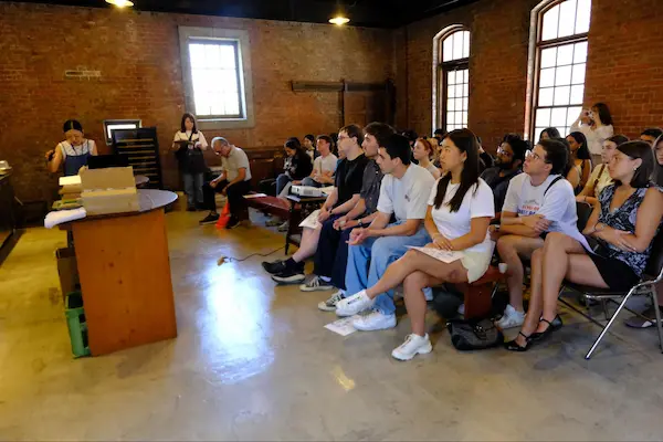 U.S. university students attending an educational presentation on sake brewing at Matsumoto Sake Brewery